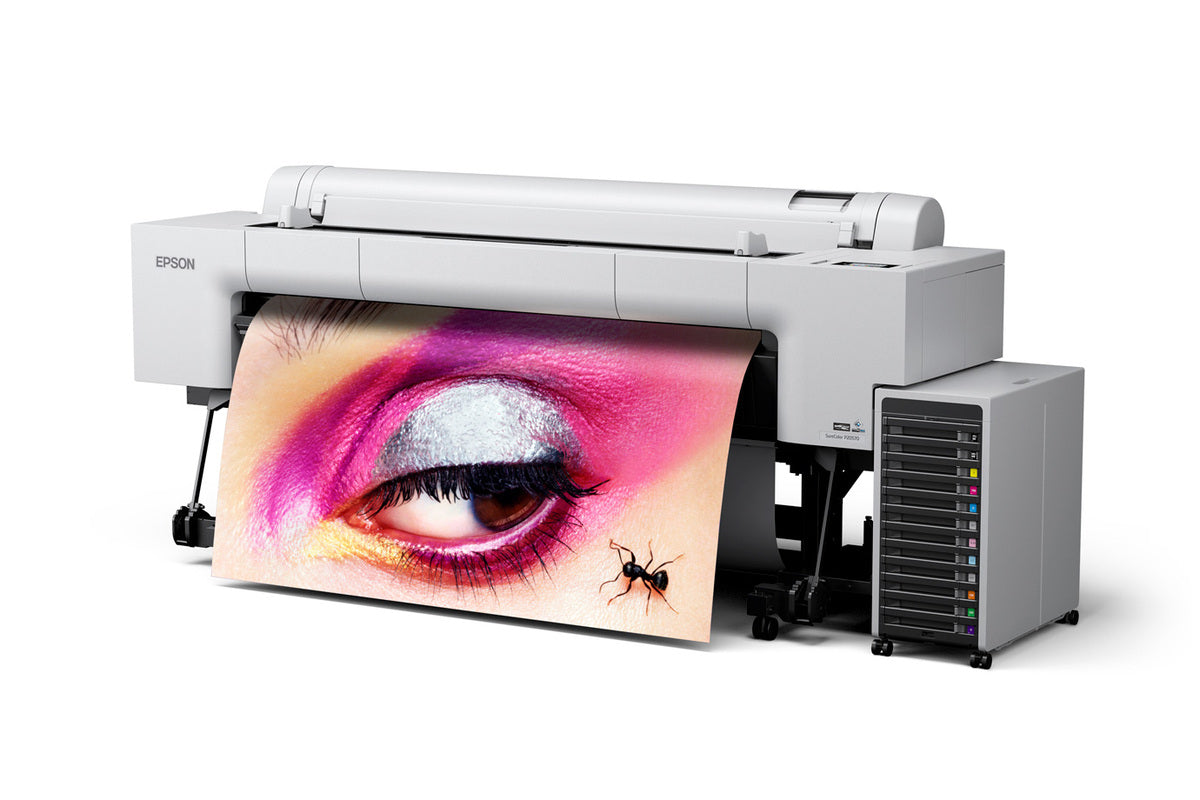 Epson Large format printer SureColor P20570 64" Professional Printer with a colorful art print coming out of it, featuring a close-up of the printer's front with a visible ink pack system and a lens for image projection.