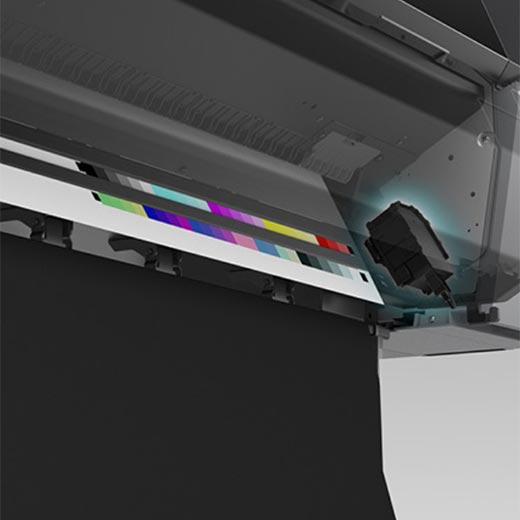 Close-up of the Epson SureColor P7570 24” Wide Printer (SCP7570SE) with printhead moving over black, cyan, magenta, yellow, and more color swatches—ideal for pro photography with Epson UltraChrome PRO12 Ink.