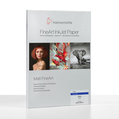A pack of Hahnemuhle Photo Rag® (308) FineArt InkJet Paper features three sample artworks—a portrait, abstract painting, and elephant—showcasing its premium quality and Photo Rag surface for exceptional inkjet printing.