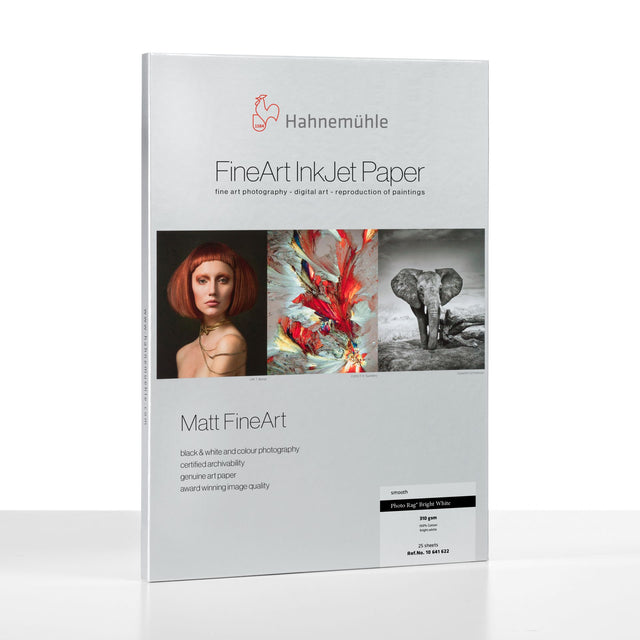 A pack of Hahnemuhle Photo Rag® Bright White, premium cotton Matt FineArt paper, features a white cover with the brand logo, product name, and sample images: portrait, abstract art, and an elephant.