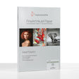 A pack of Hahnemuhle Torchon FineArt InkJet Paper, made with archival-quality watercolor paper. The white packaging features red and black text, the Hahnemuhle logo at the top, plus images of a woman, abstract art, and an elephant.