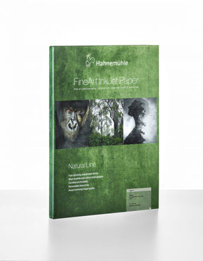 A green package of Hahnemuhle Agave Paper shows a gorilla, forest, and leaf silhouette, emphasizing its eco-friendly FineArt inkjet paper made from agave fibers.