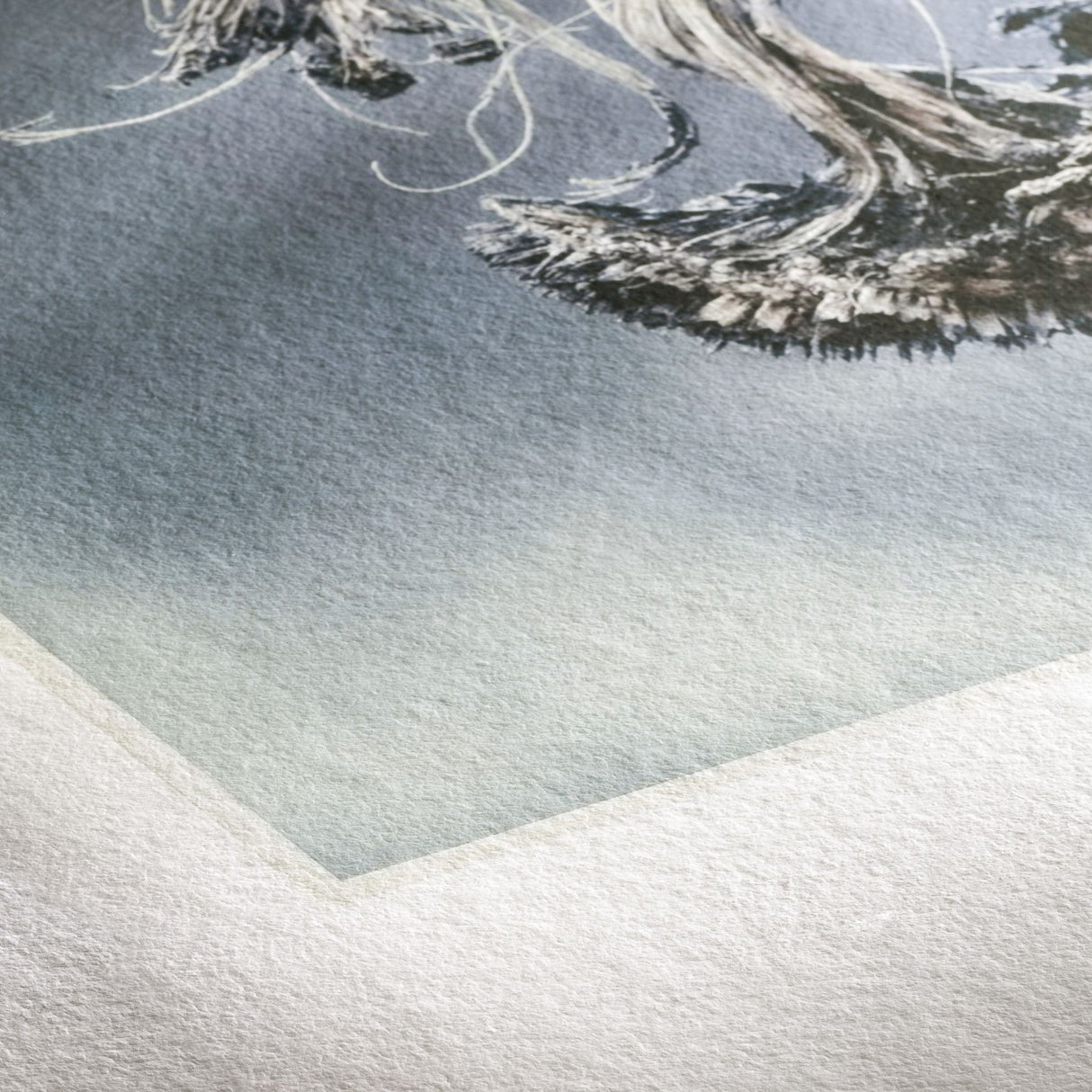 Close-up of a Hahnemuhle Museum Etching art paper corner, featuring part of an artwork with dark and light brush strokes on a softly blended blue-gray background.