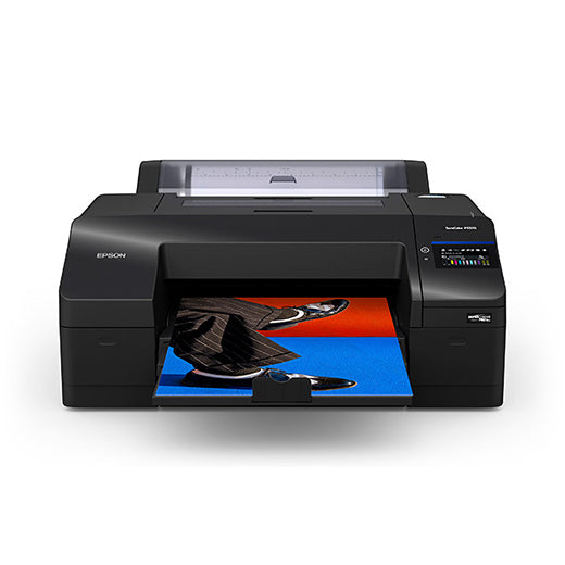 A black Epson SureColor P5370 17" wide printer (SCP5370SE) is printing a vibrant image with blue, red, and black shades. This Epson printer features a convenient control panel on the right side.