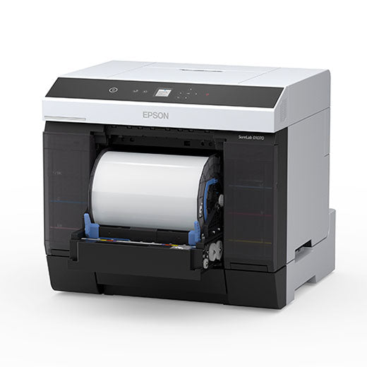 A front view of the Epson SureLab D1070DE Professional Minilab Photo Printer with Double-Sided Printing (SLD1070DE), showing its open front panel and visible paper roll. The mostly white and black printer has a top digital display.