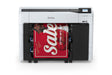 An Epson SureColor T3770DR 24" Wide-Format Dual-Roll CAD/Technical Printer from Epson prints a vivid red "Sale" poster with bold white letters and "EXTRA 30% OFF," its control panel located at the upper right.