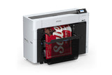 An Epson SureColor T3770DR 24" Wide-Format Dual-Roll CAD/Technical Printer is printing a large, vibrant sale poster with a red background and white text; the partially printed poster emerges from the high-speed printer with a display screen on top.