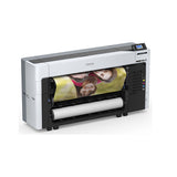An Epson SureColor P8570DL 44-Inch Wide-Format Dual-Roll Printer with a high-capacity 1.6 L ink pack system prints a vibrant poster of three smiling people on glossy paper, control panel top right, ink packs visible in front.