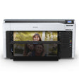 An Epson SureColor P8570DL 44-Inch Wide-Format Dual-Roll Printer with High-Capacity 1.6L Ink Pack System prints a vibrant photo of a smiling woman hugging a man, with another photo of a child above; its front panel and display are visible.