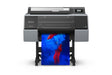 The Epson SureColor P7370 24" Wide Printer by Epson prints a vibrant photo of a person in a red outfit and blue wig amidst blue and red smoke on glossy paper using UltraChrome PRO10 Ink.