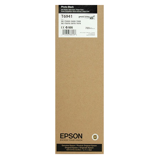 A brown Epson box labeled T694100 contains the Epson Ultrachrome XD Photo Black Ink Cartridge (700 ml), compatible with SureColor T3270 and other SureColor T-Series printers, featuring black and white product details and branding.